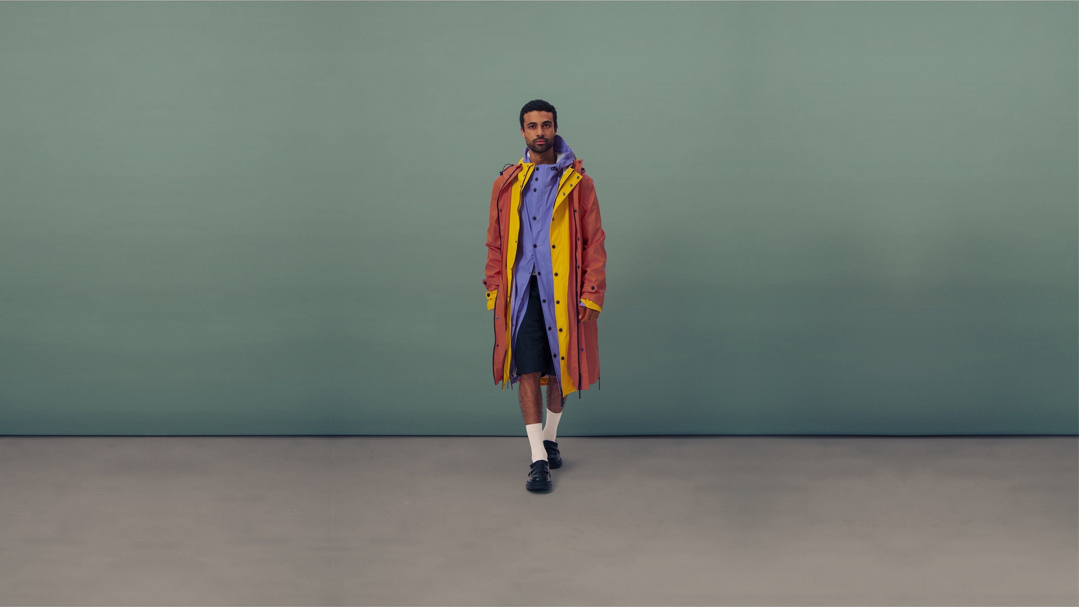 Man wearing Original, MAIUM's best selling waterproof raincoat.